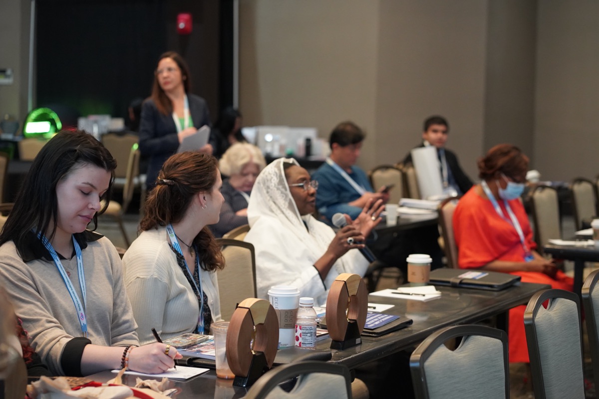 Attendees taking notes